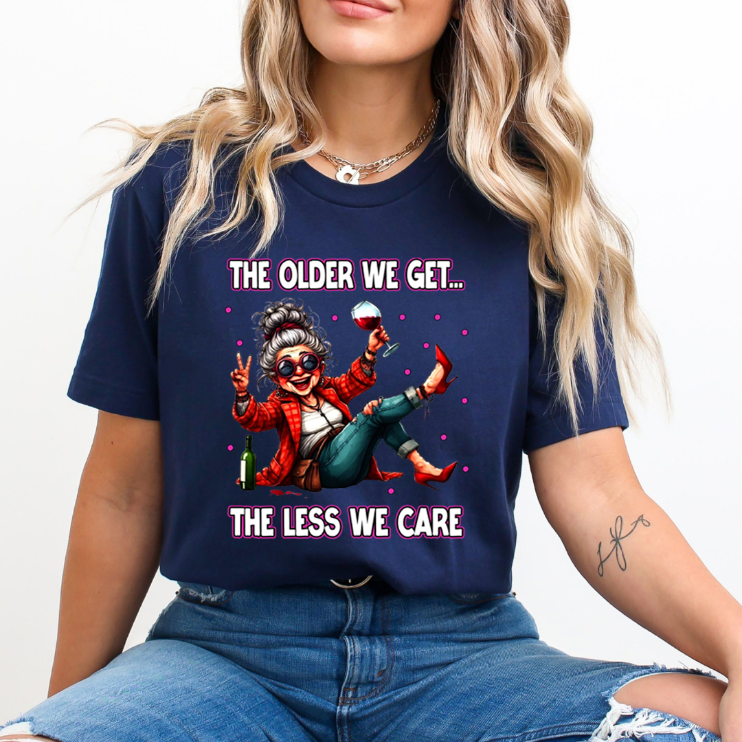 The Older We Get.. The Less We Care  - T-Shirt