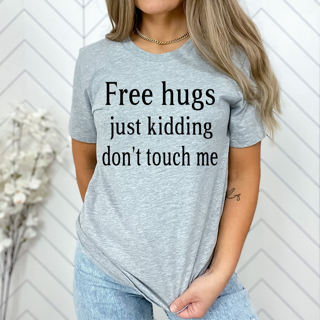 "FREE HUGS JUST KIDDING"